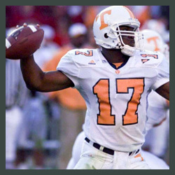 Tee throwing a football